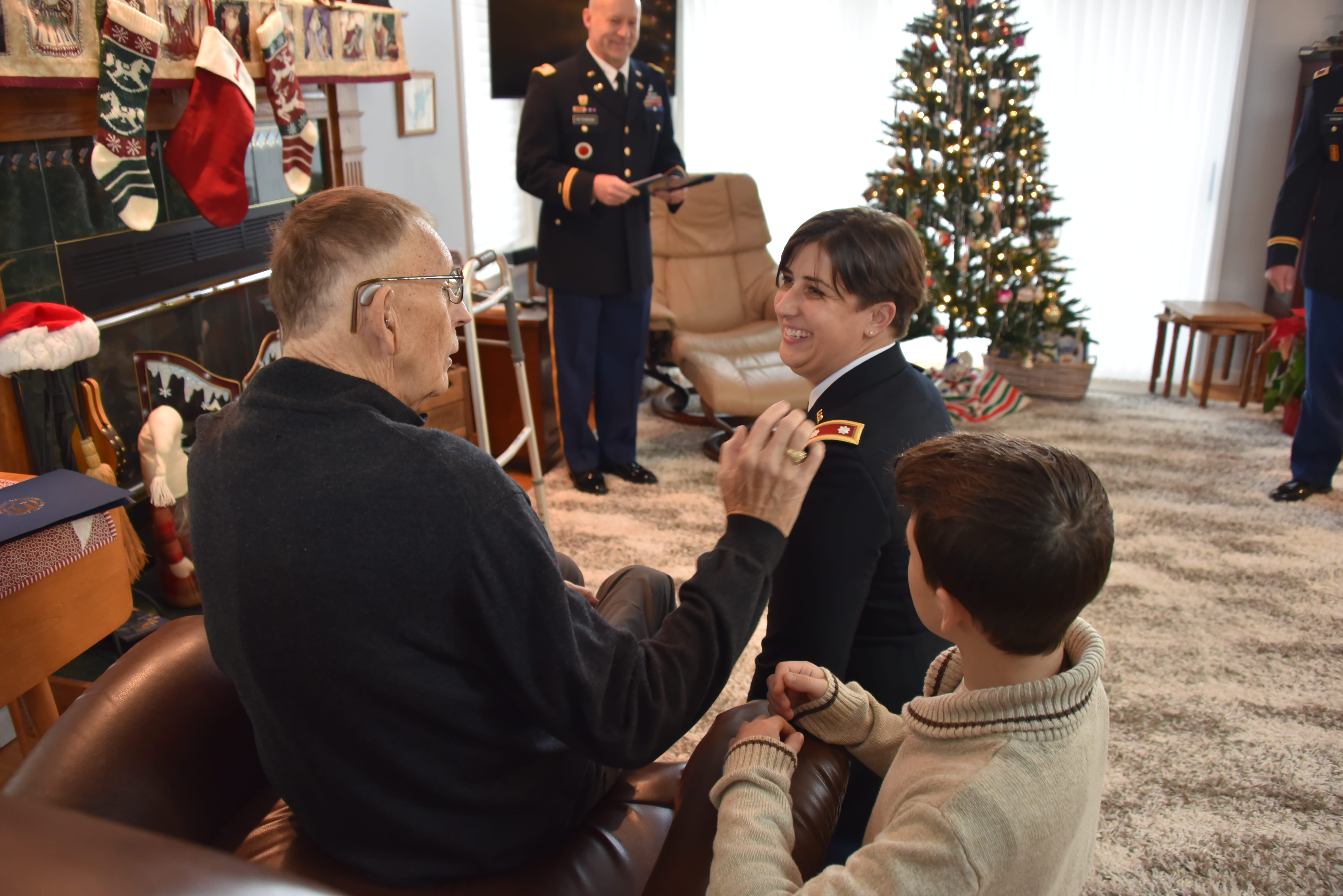 LTC Ashley Dykes receives promotion pin from her uncle SGT Danny Walburn
