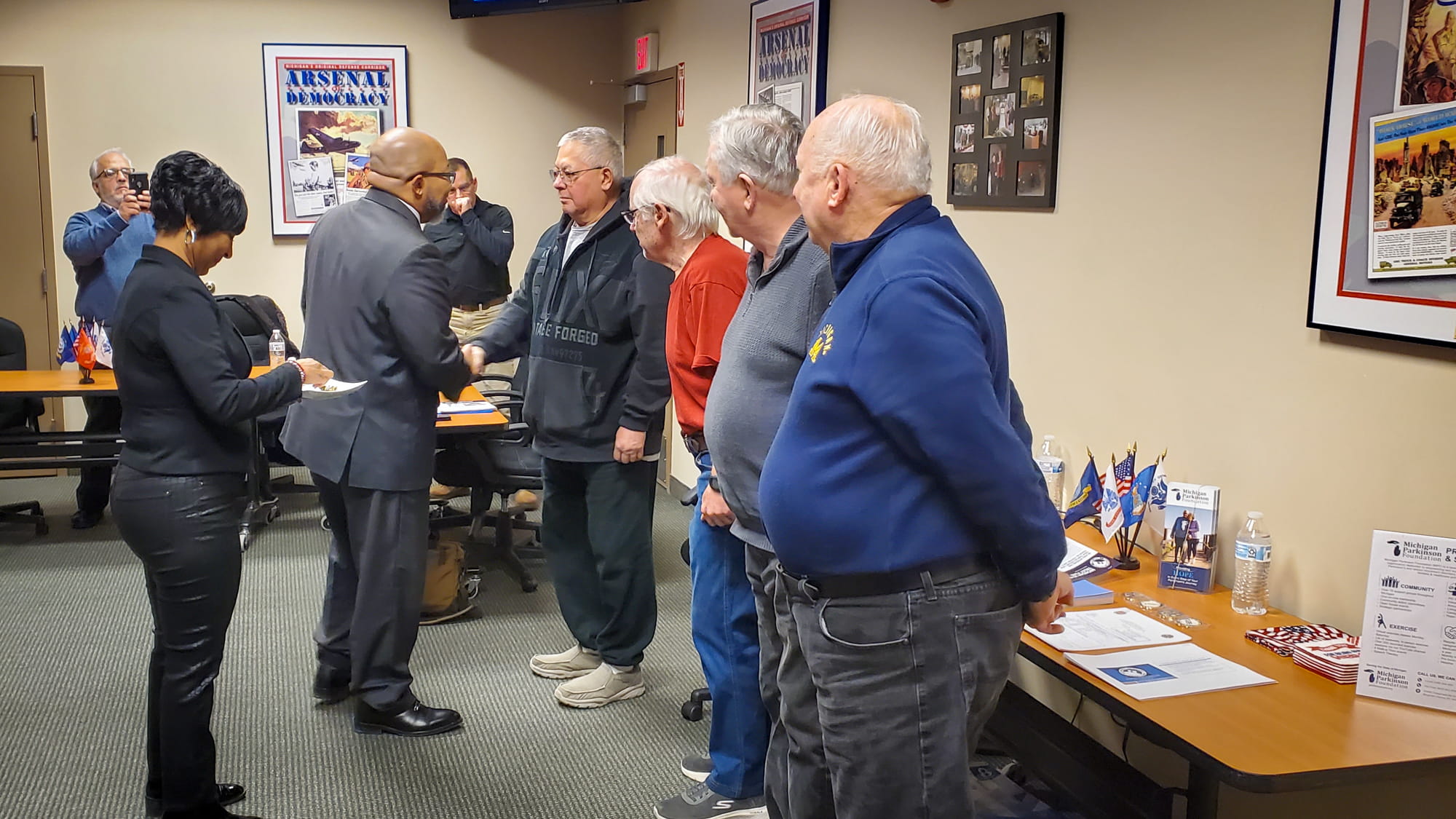Director Brian L. Love visits with members of the Veterans with Parkinson's Support Group