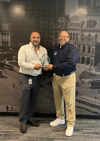 Michigan Veteran Affairs Agency Director Brian L. Love (right) presented Securatech President and CEO Rudy Patros (left) with MVAA's Gold-level Veteran-Friendly Employer award Monday, June 24, 2024 in Farmington Hills.