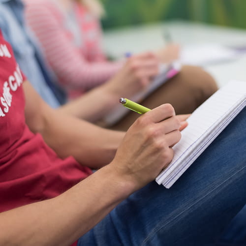 Man writing in notebook