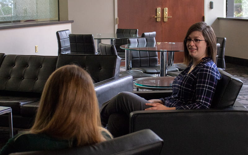 Women in office talking