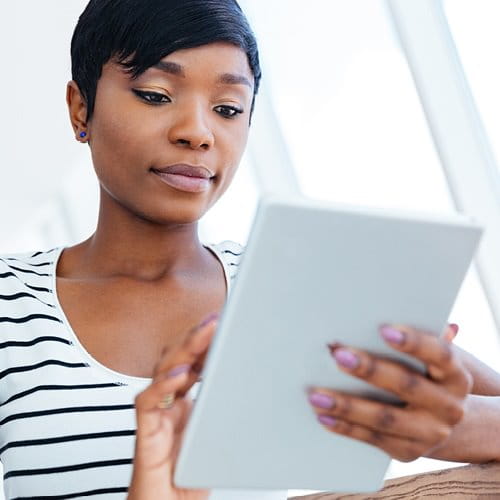 Woman viewing records on e-reader