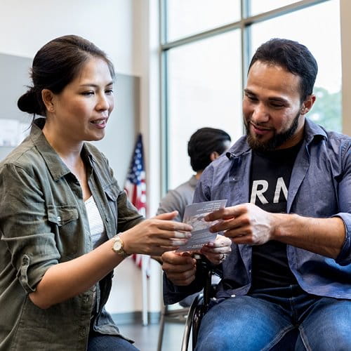 Veteran reviewing benefit options with VA employee