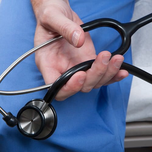 Doctor holding stethoscope