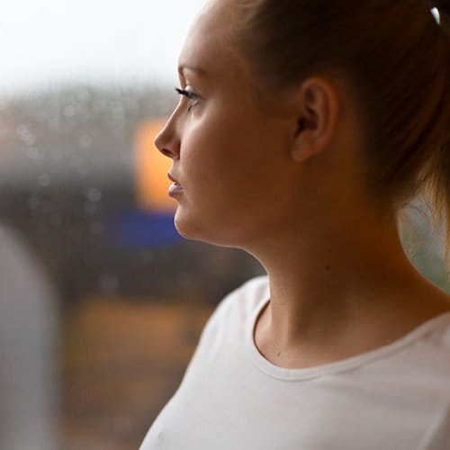 Woman looking out the window