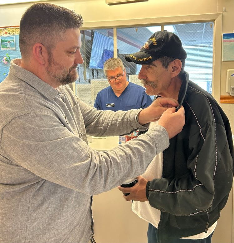 Veteran Service Officer Eric Martin pins Vietnam War veteran George Bowen Jr.