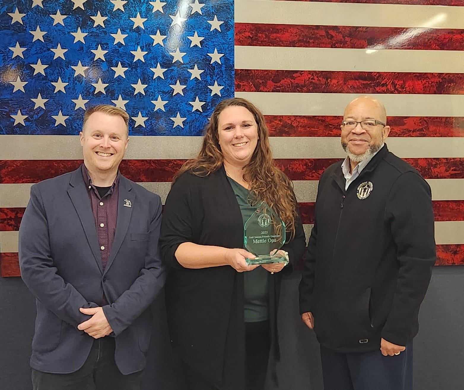Erik Schreur, MVAA employment analyst; Katie Bigelow, Mettle Ops president and chief executive officer; and Brian L. Love, MVAA director
