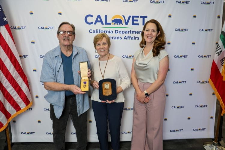 California Department of Veterans Affairs secretary Lindsey Sin presents John Van Doorne's Purple Heart to his nephew, William Alofs, and niece, Lou Ellen Blouw. Photo courtesy of the California Department of Veterans Affairs