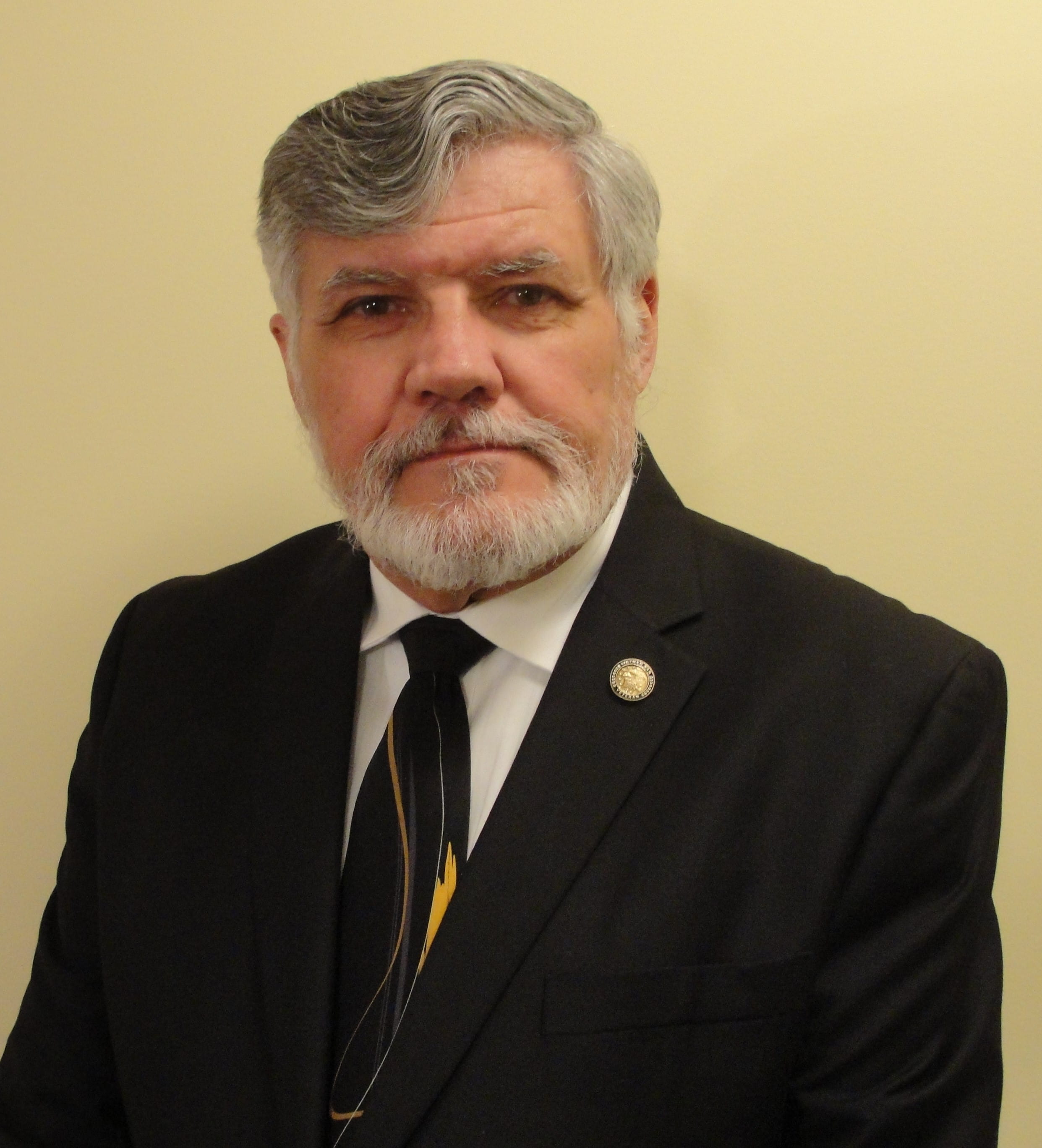 Award recipients stand on stage at the gala displaying their certificate