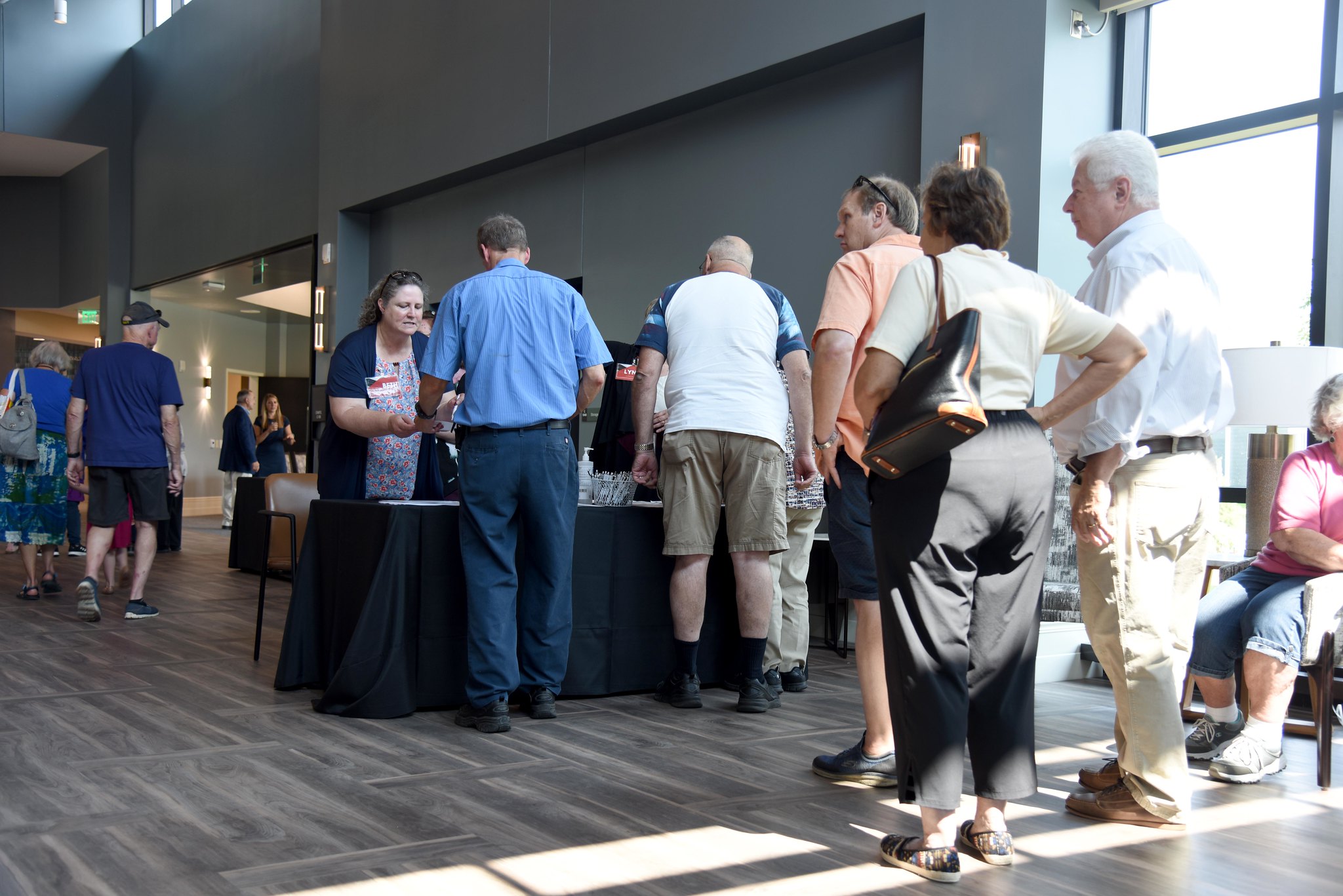 Community members stand in line at MVHGR lobby