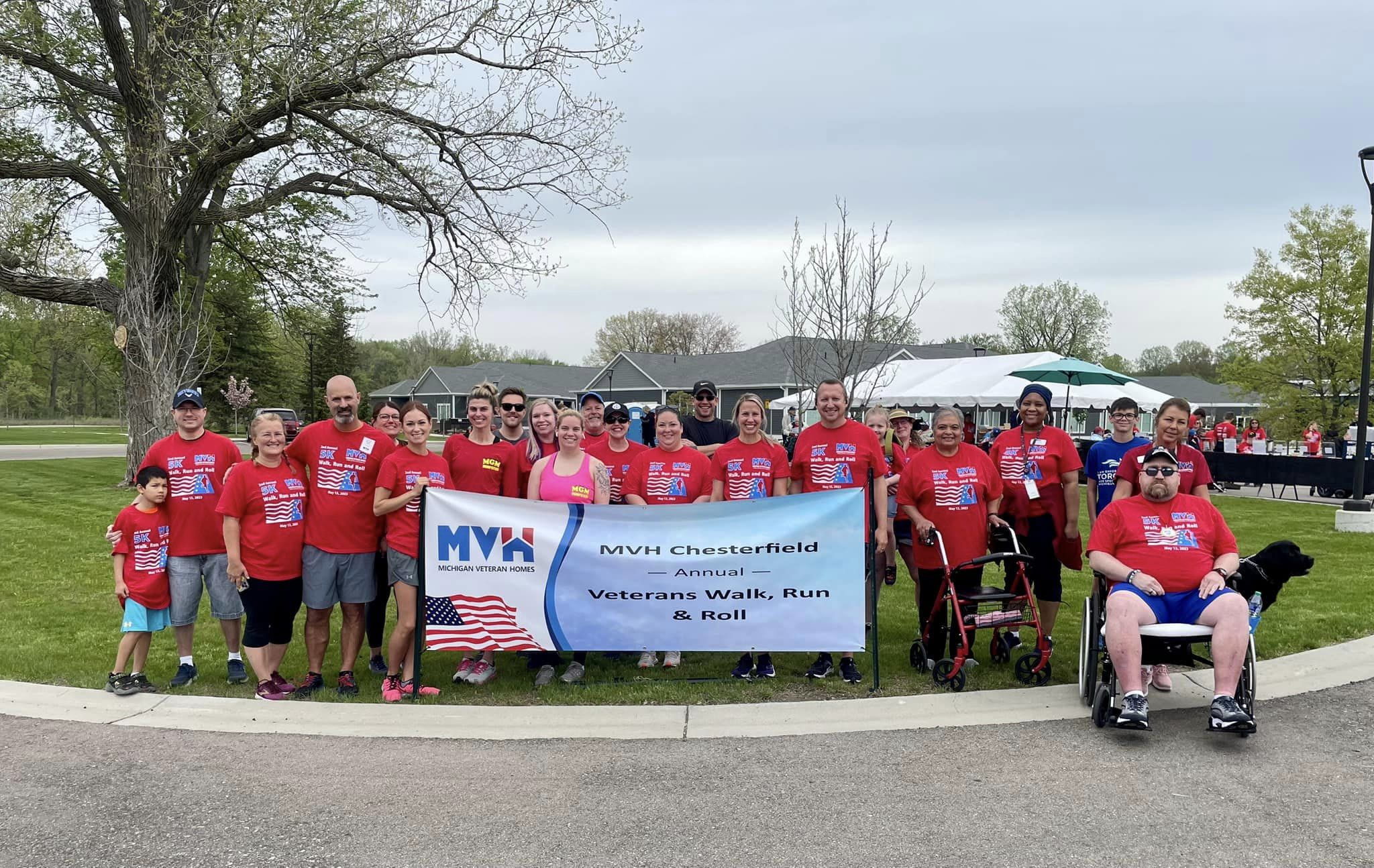 Award recipients stand on stage at the gala displaying their certificate