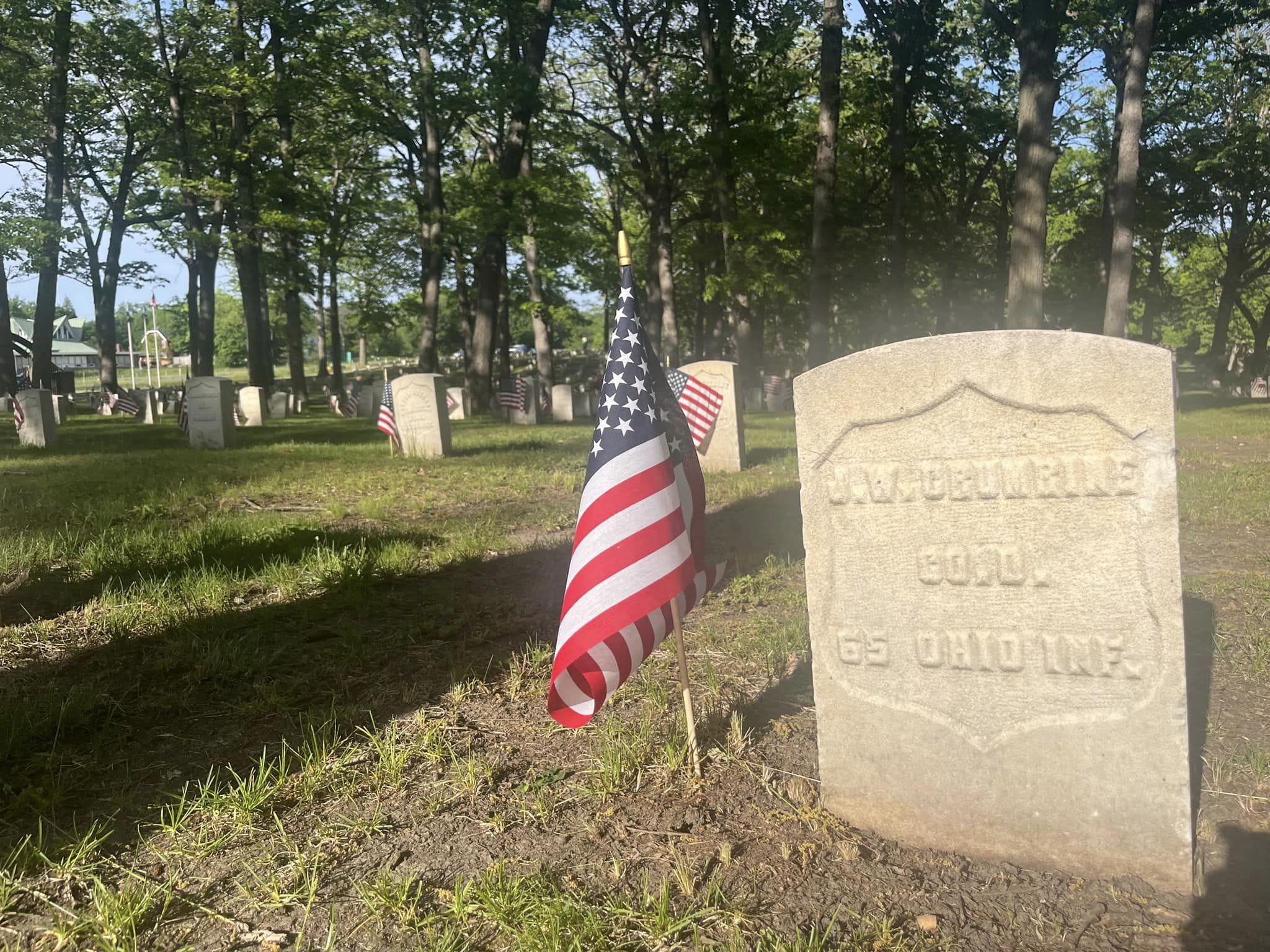 Award recipients stand on stage at the gala displaying their certificate