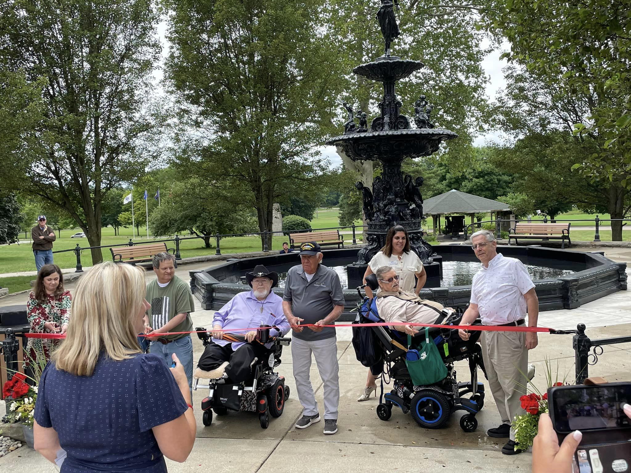 Award recipients stand on stage at the gala displaying their certificate