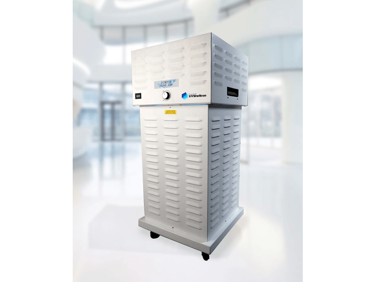 Award recipients stand on stage at the gala displaying their certificate