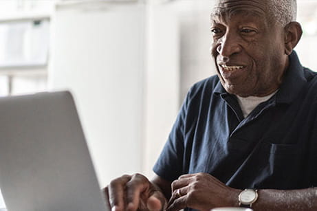 Veteran browses laptop