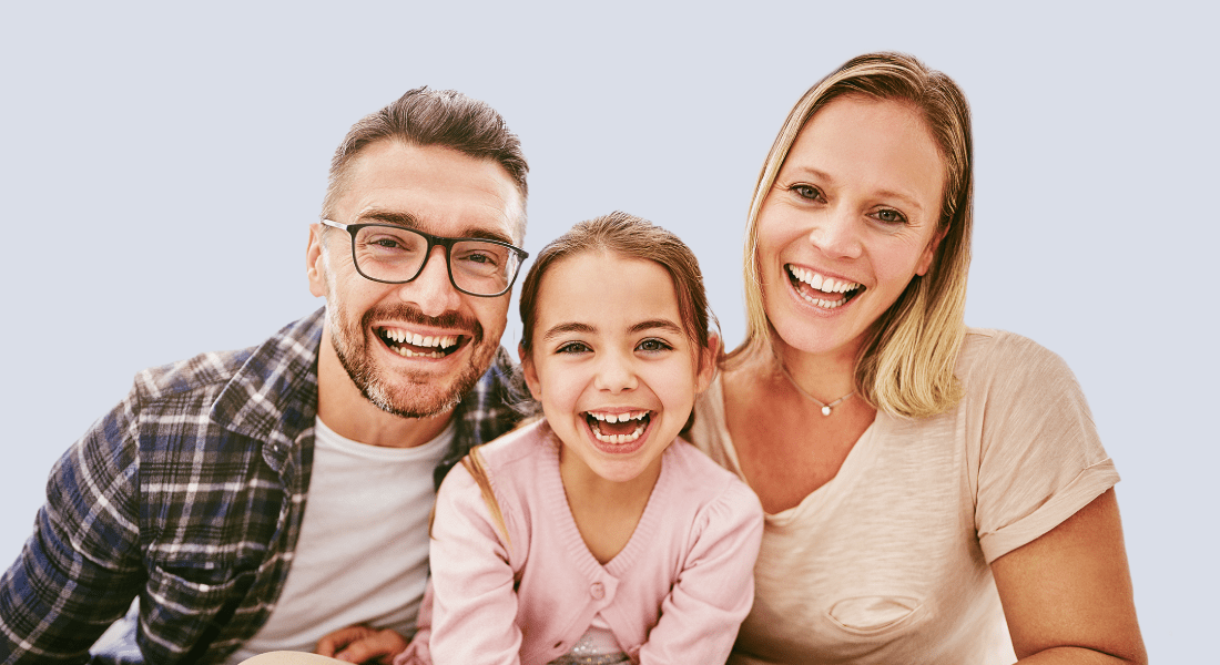 Family smiling at camera
