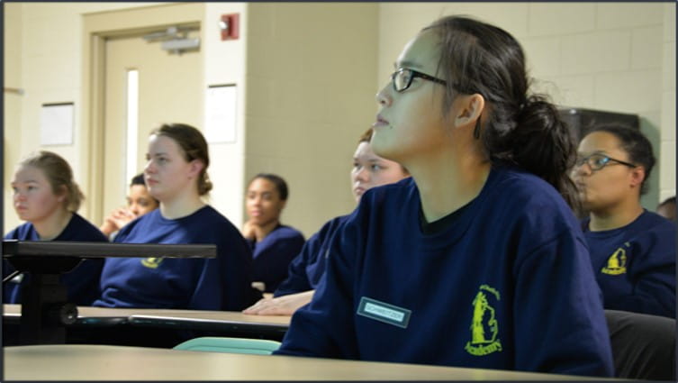 MYCA women sitting at desks indoors