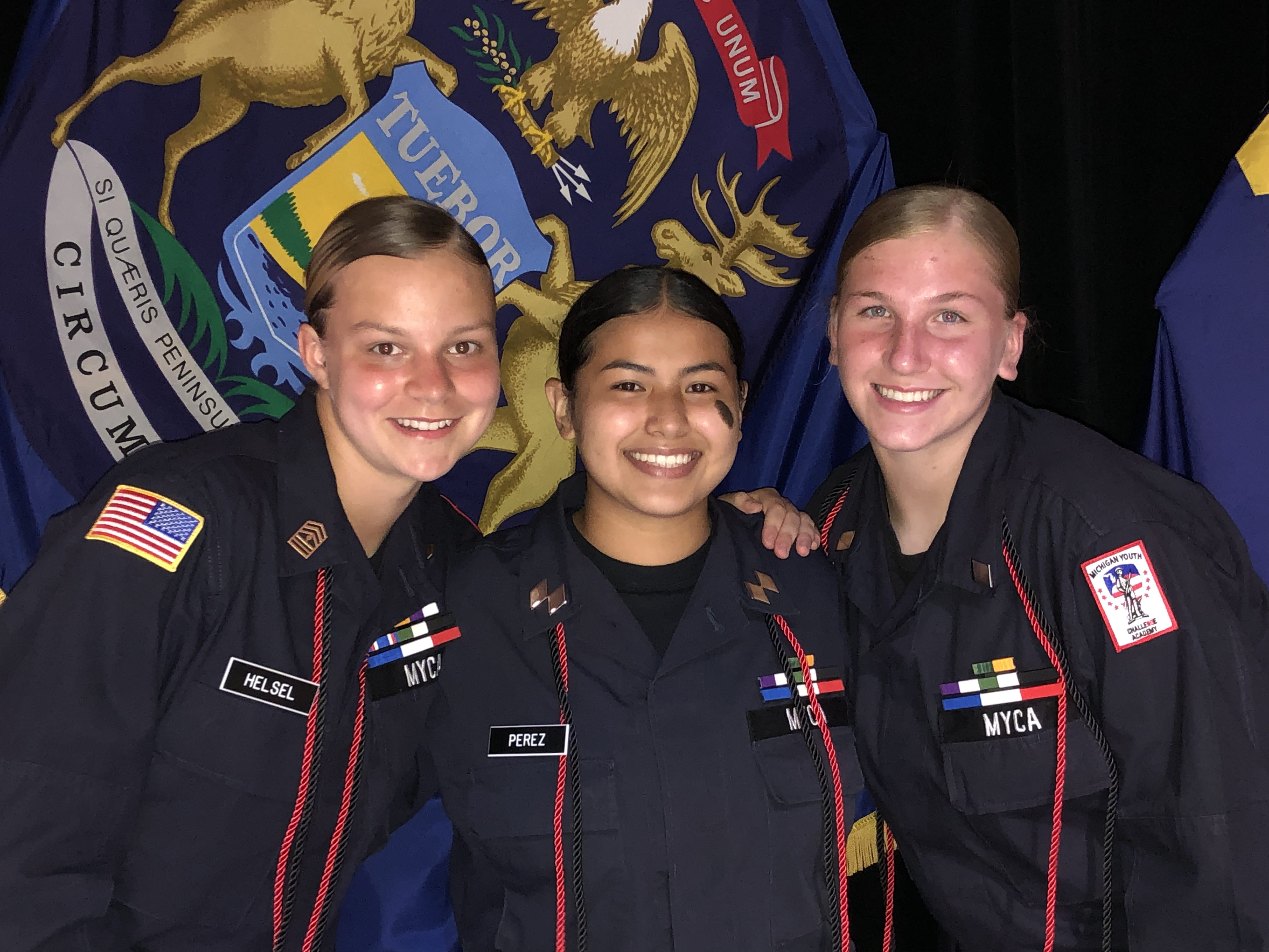 Women cadets in uniform posing for a picture