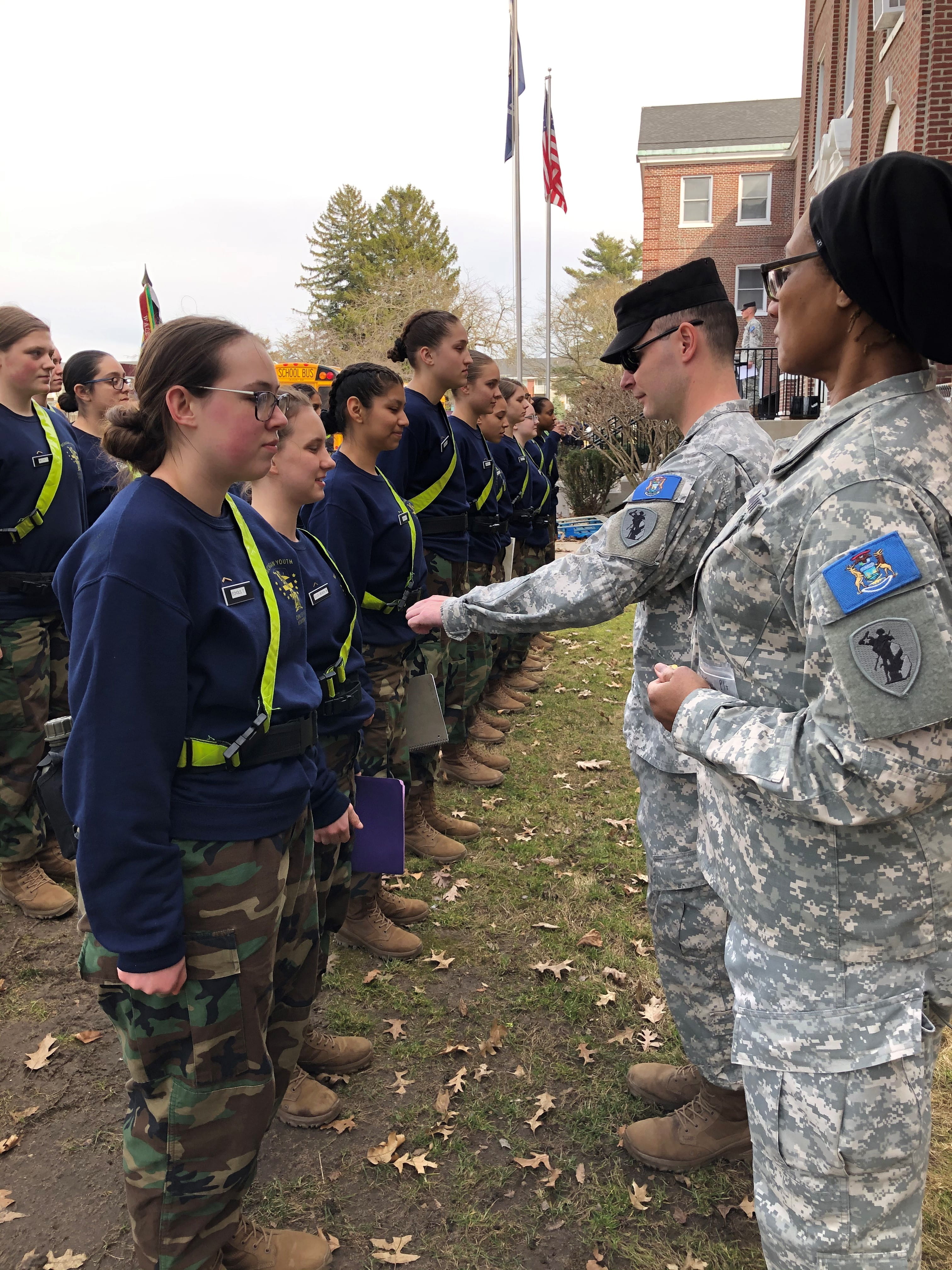 cadets in line being addressed by cadre