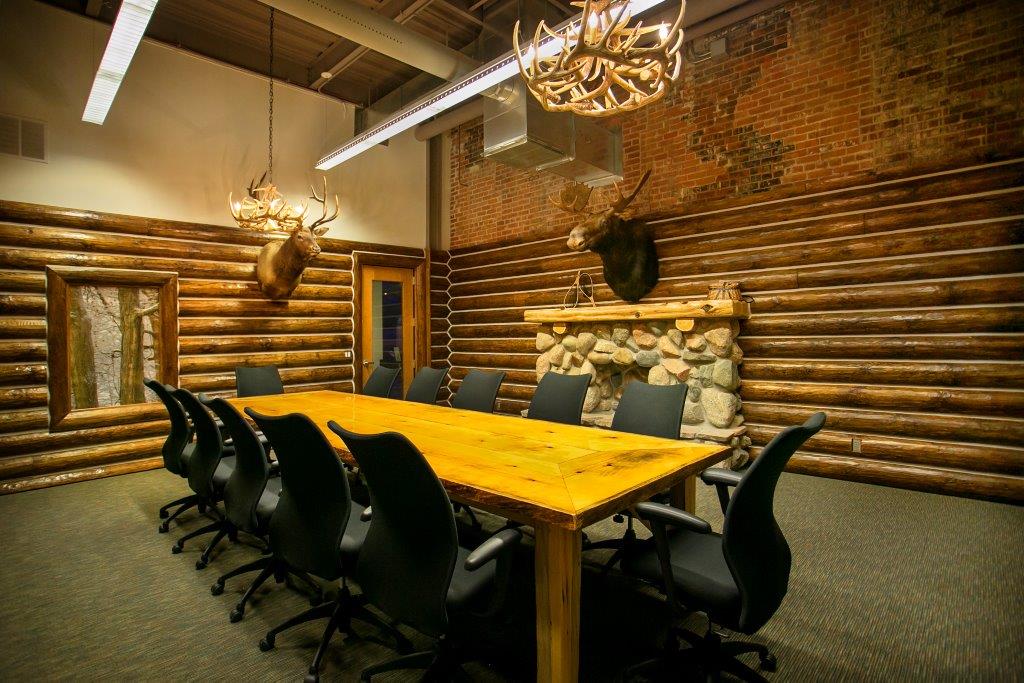 The Lodge meeting room at Outdoor Adventure Center, featuring wilderness cabin-like decor.