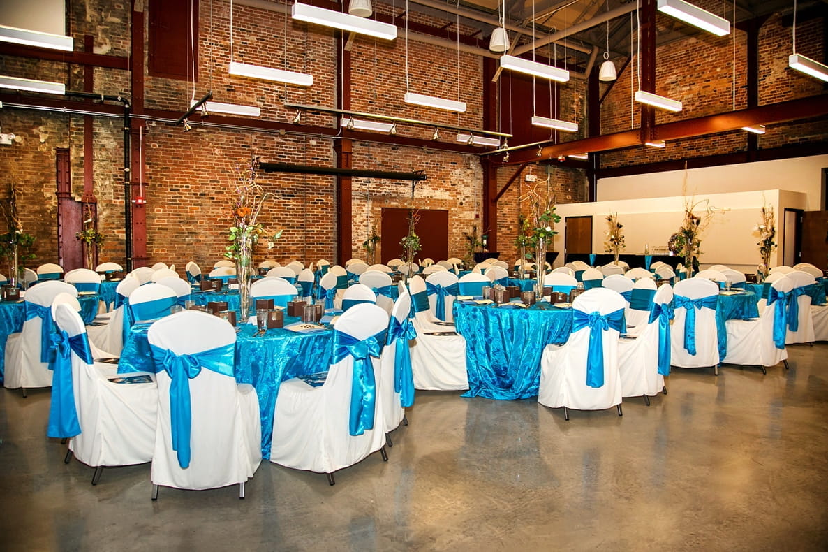 The Outdoor Adventure Center's Riverview Loft room, decorated in blue and white for a gala event.