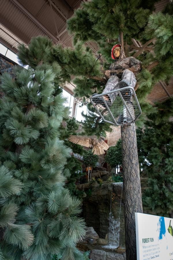 life-size figure of hunter in tree stand