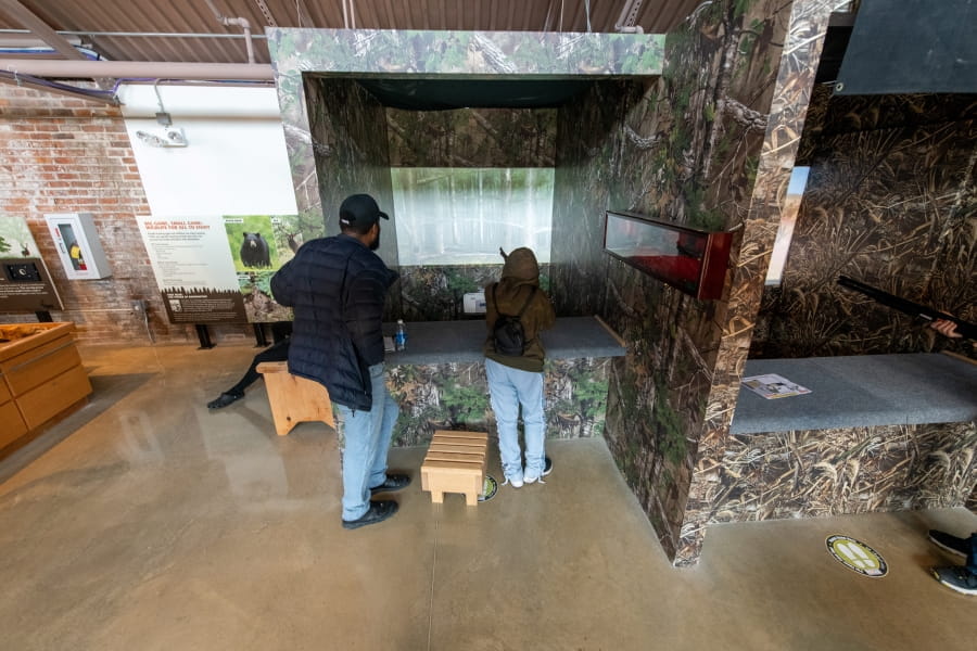 two people use hunting simulator at OAC