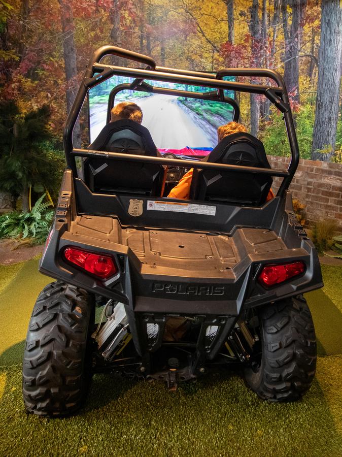 two people in OAC off-road vehicle simulator