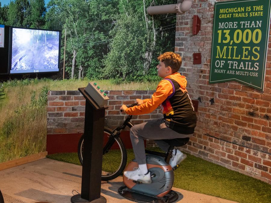 boy uses OAC mountain biking simulator