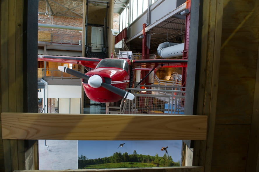 front view of red airplane at Outdoor Adventure Center and propeller