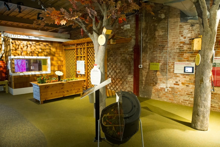 Outdoor Adventure Center Nature in Your Neighborhood exhibit, with garden, trees, birdhouses