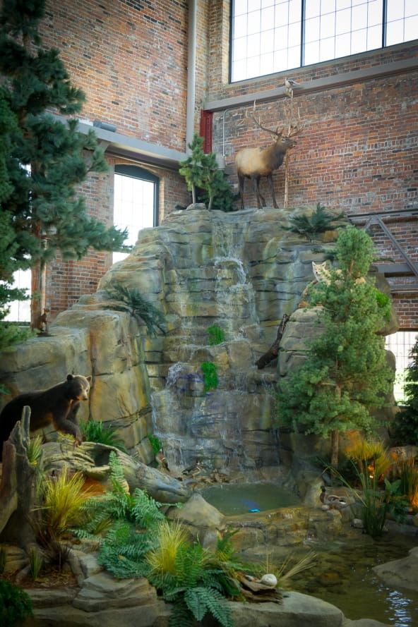 upper part of the Outdoor Adventure Center waterfall, with elk at top