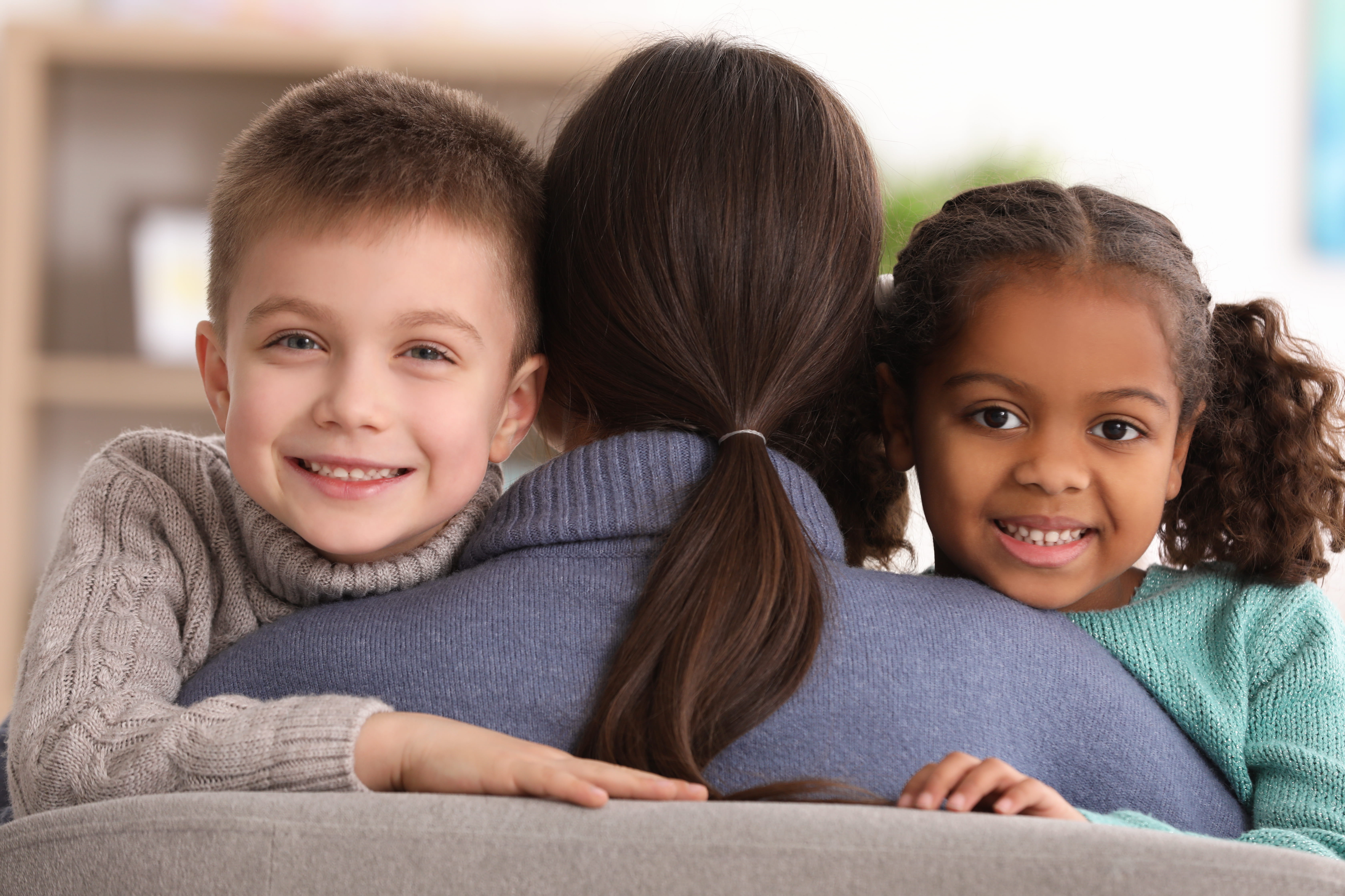 two kids with a woman