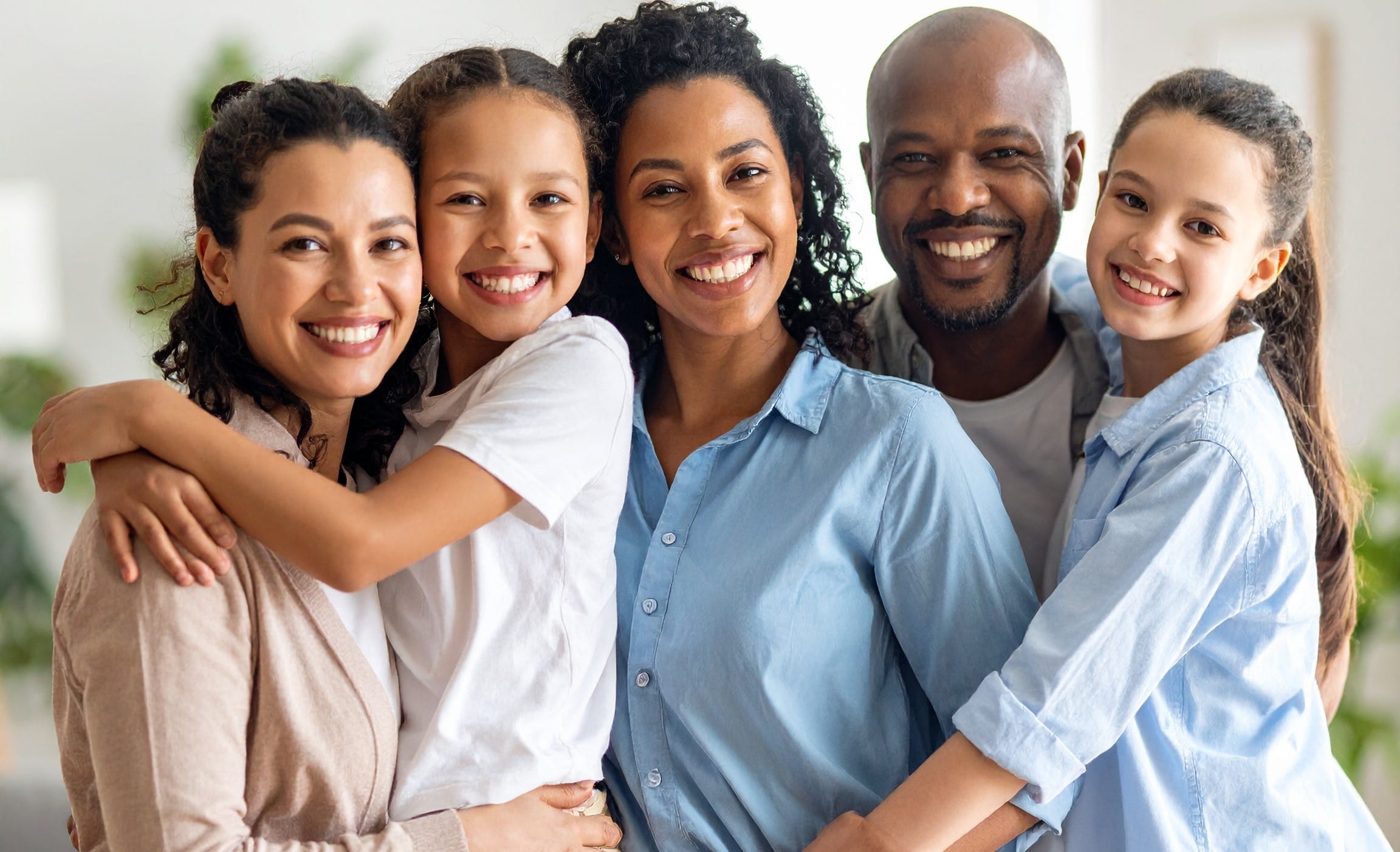 Diverse family photo with adults and children