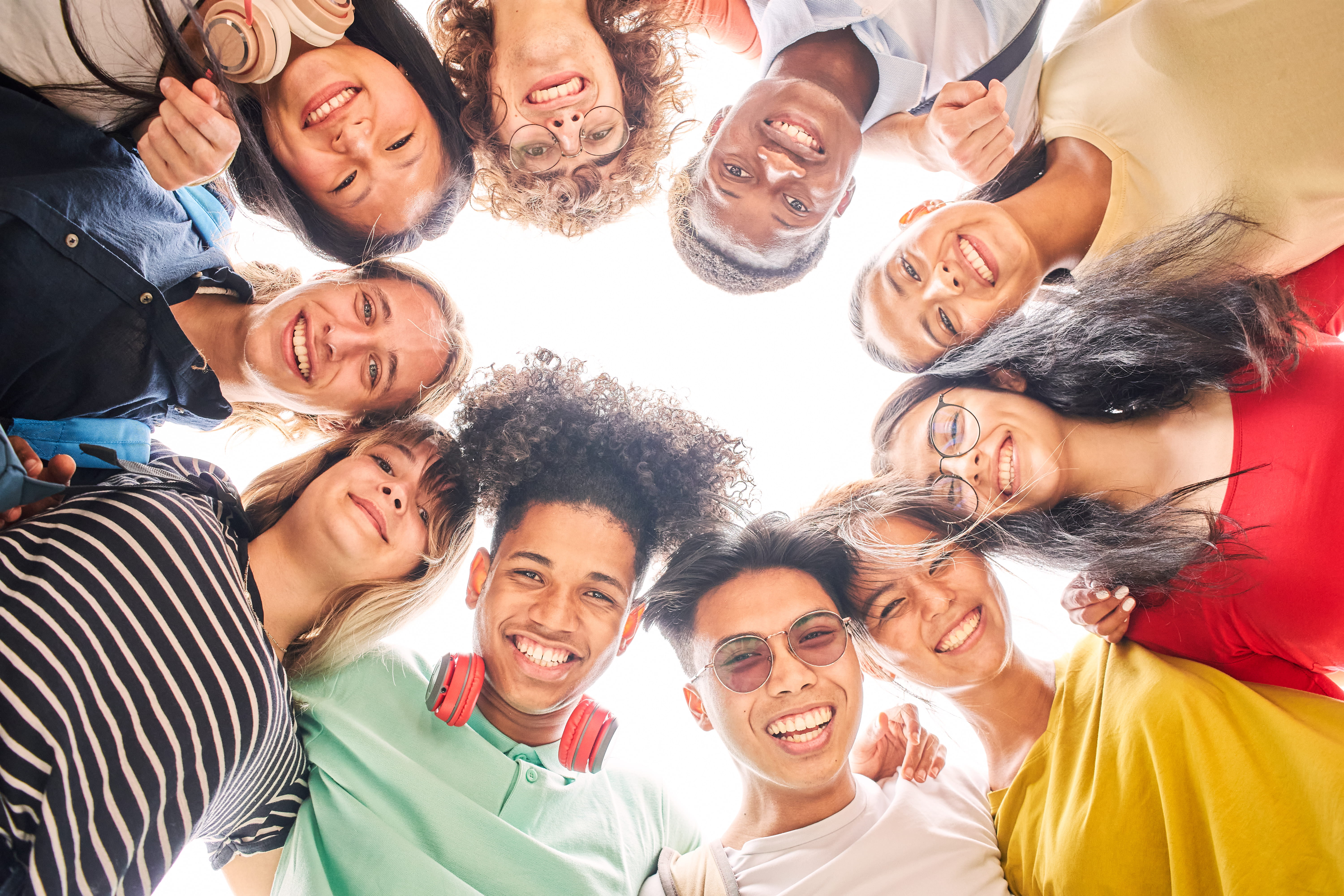 teenagers in a circle smiling
