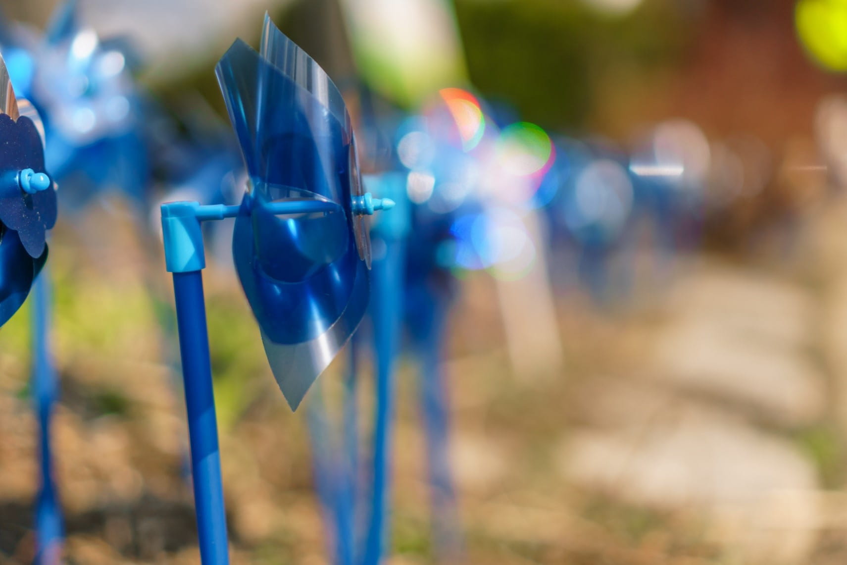 a row of blue pinwheels for child abuse prevention awareness 