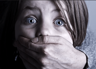 Girl with hand on mouth