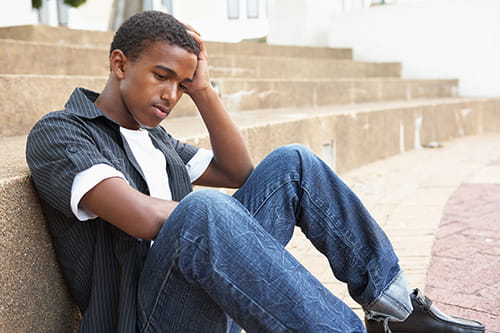 Depressed Teen on Stairs