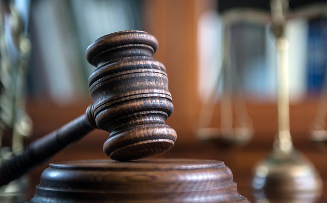 Image of a gavel in a courtroom