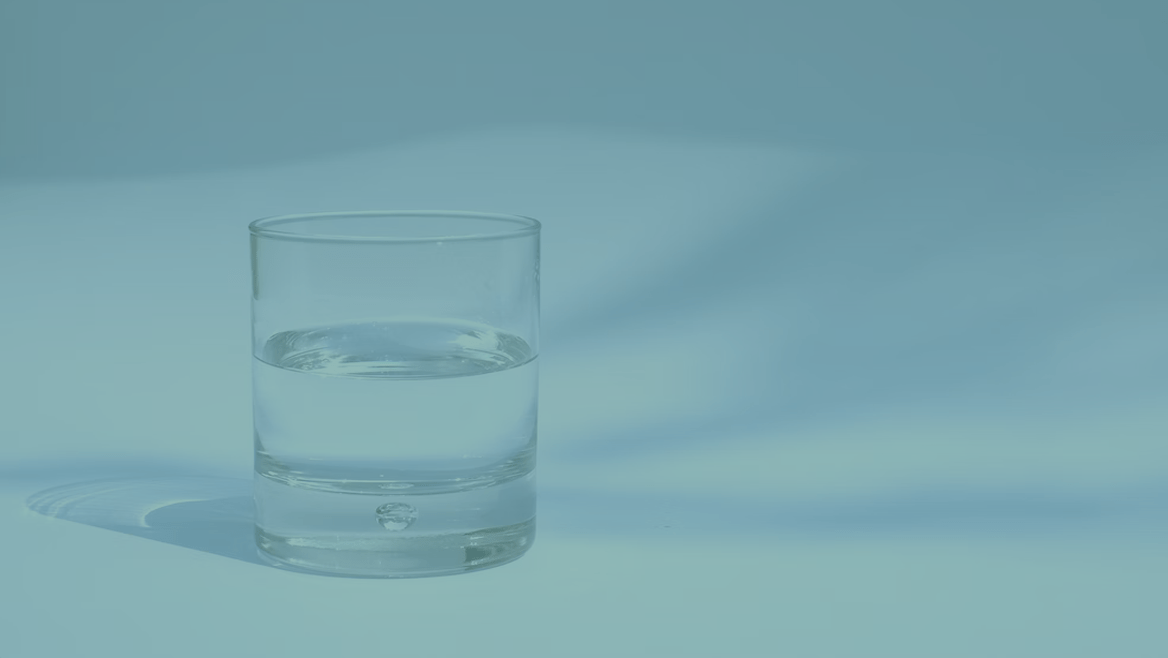 A glass of drinking water, with a teal overlay