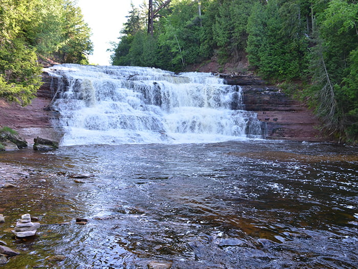 cascading falls into river