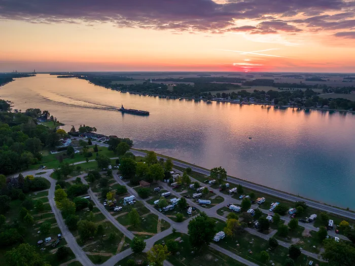 birds eye view of campground with freighter in river