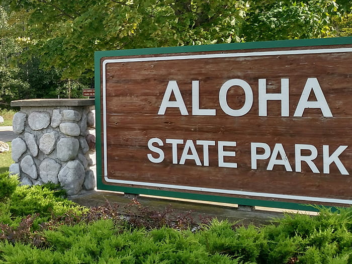 Aloha State Park wooden entrance sign