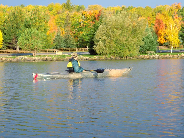 kayaker with fall colors