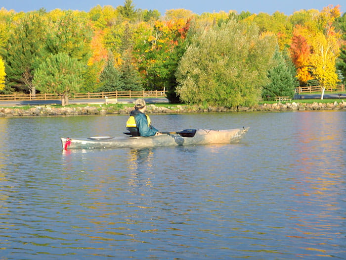 kayaker with fall colors