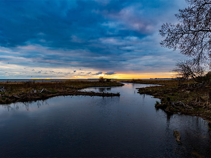 water under dark blue and cloudy sky
