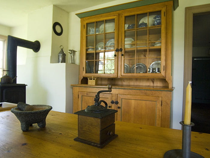 kitchen cabinet and table with historic items