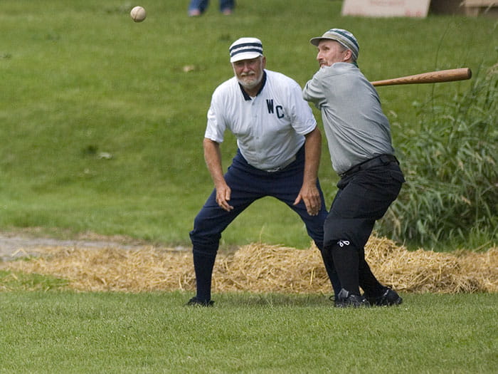 men playing baseball as part of historic enactment