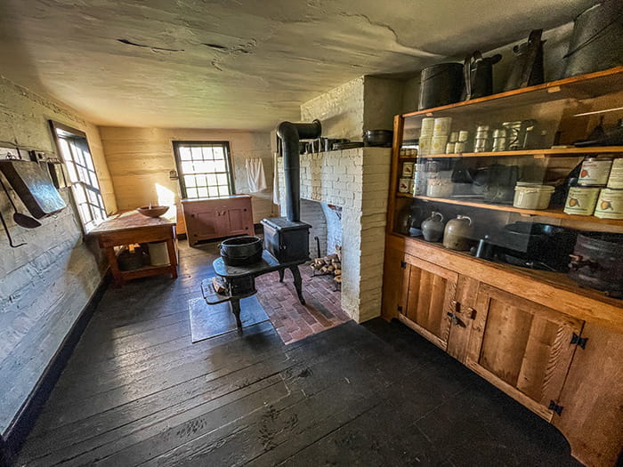 interior of historic cabin with pottery