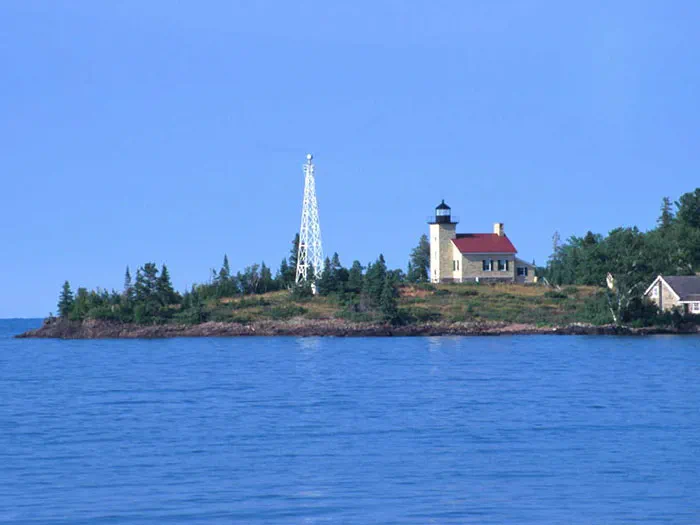 lighthouse with water in front